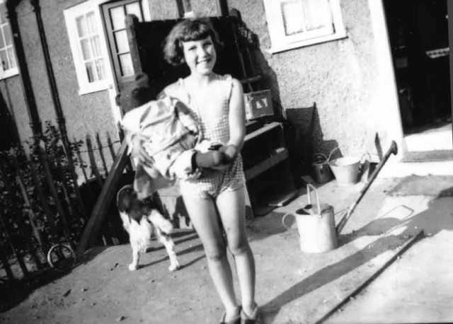 1.Helen in back garden, Dagenham, Hector the dog behind her copy